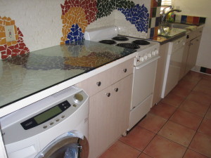 Kitchen with colorful designed tile